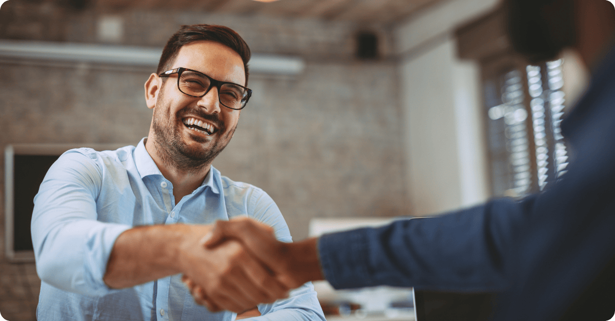 A Professional Man Shaking Hands with a Client